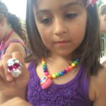 young girl with toy ring