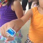 young girl with toy ring