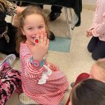 THE young girl holding a toy ring